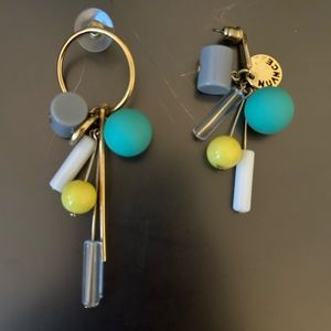 Asymmetrical earrings with gold accents